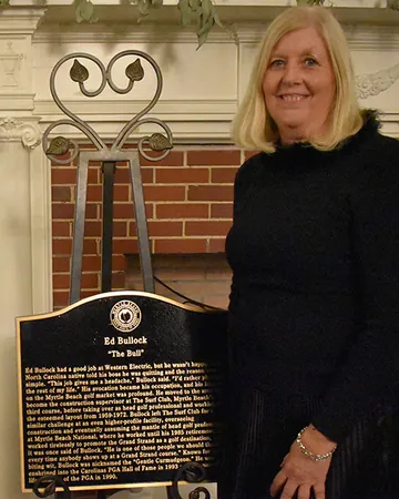Trisha Bullock accepted the induction plaque on behalf of her father.